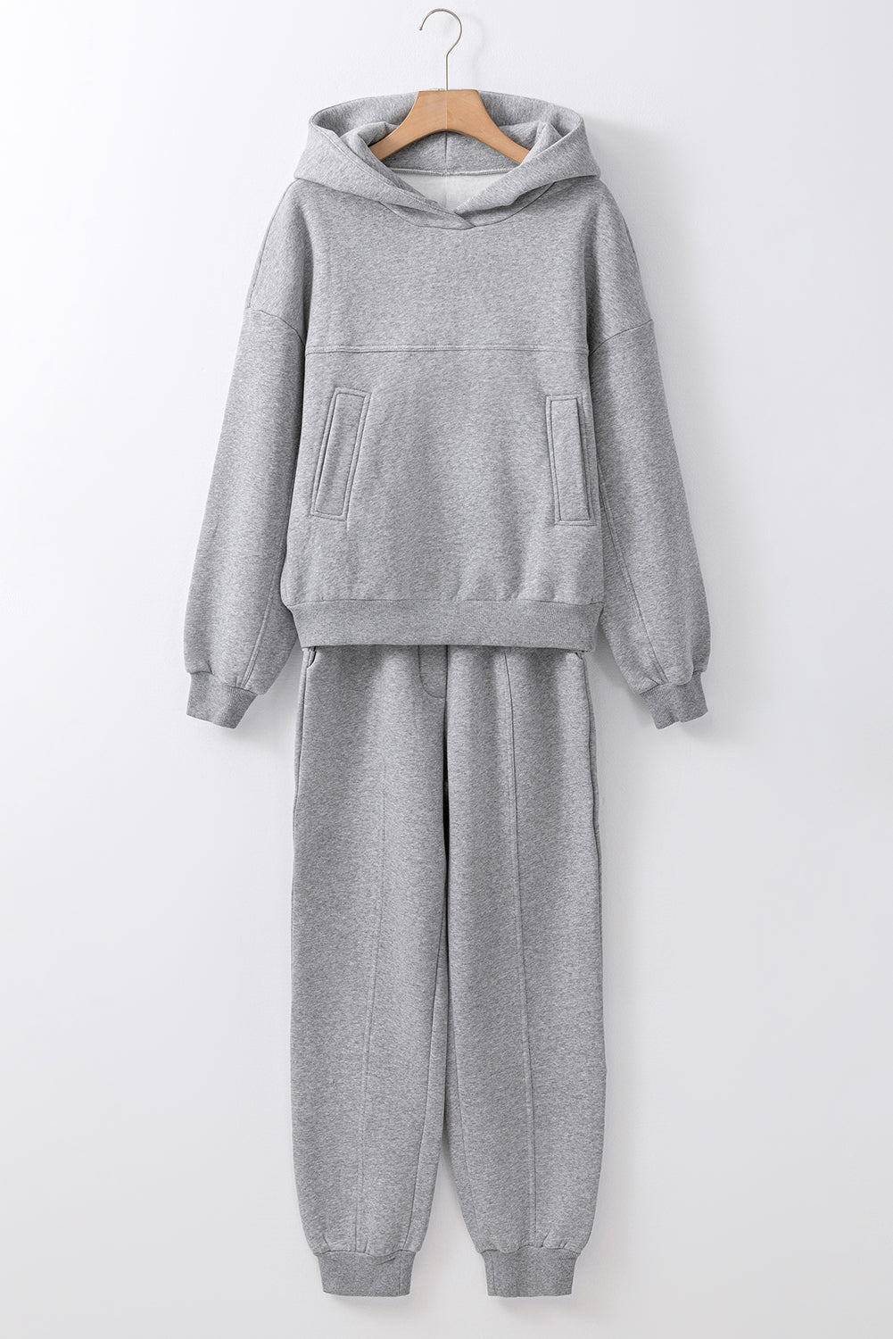 Stylish gray hoodie and joggers set with exposed seams