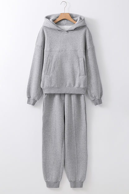 Stylish gray hoodie and joggers set with exposed seams