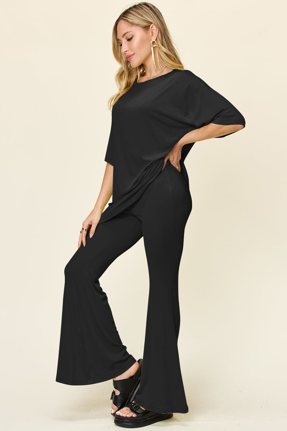 Double Take Full Size Round Neck Drop Shoulder T-Shirt and Flare Pants Set.