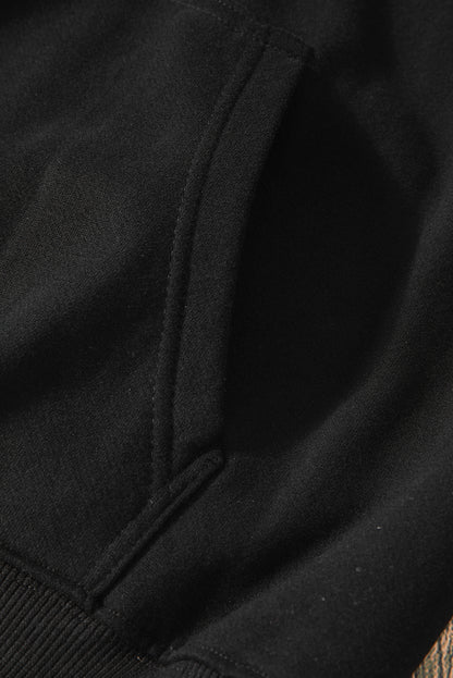 Cozy black fleece-lined hoodie with kangaroo pocket and drawstring design