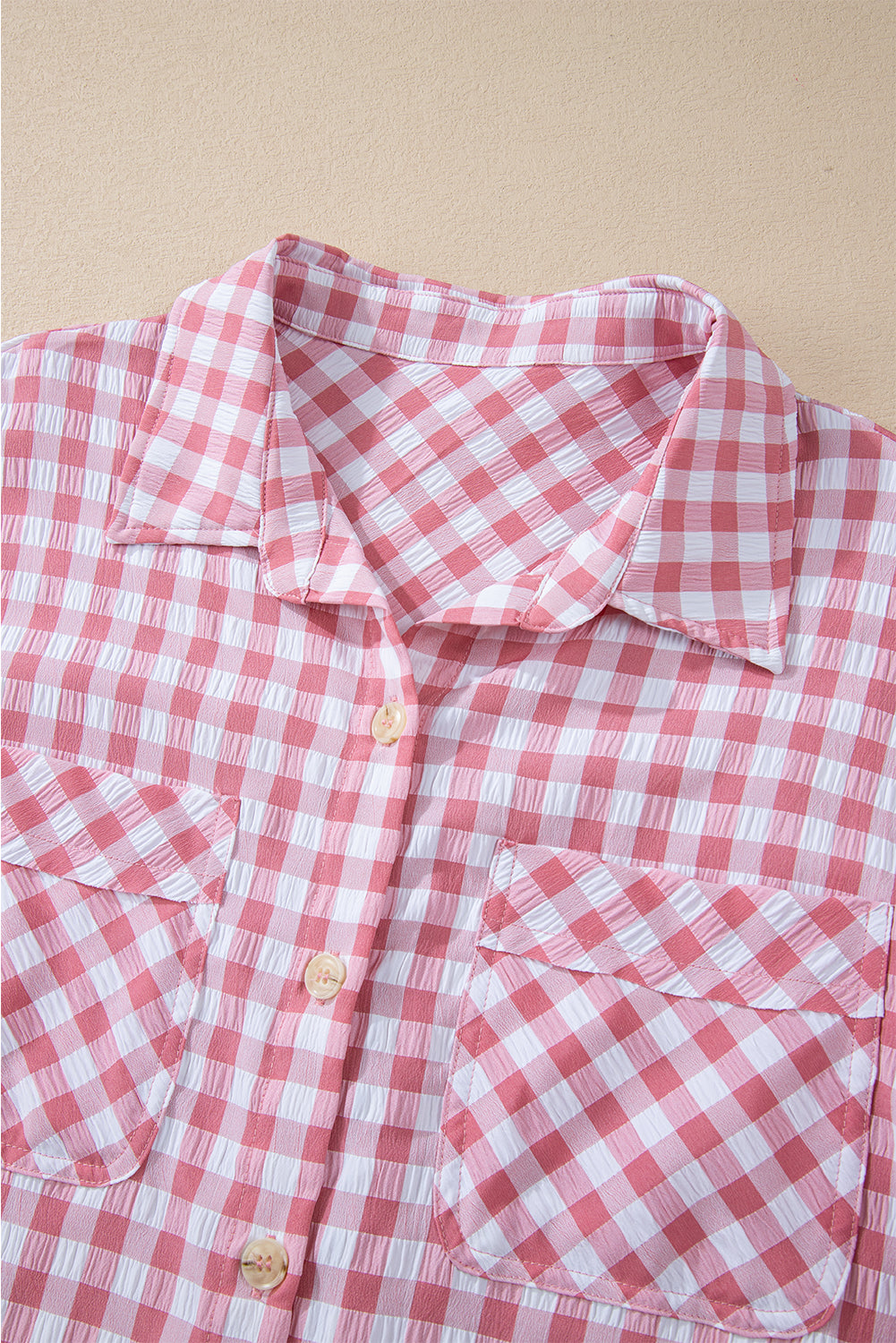 Chic pink gingham collared shirt with functional chest pockets