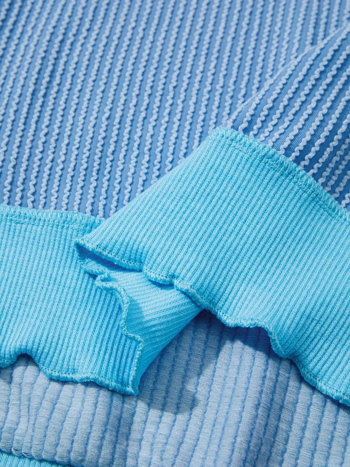 Twisted Rib Uneven Hem Drop Shoulder Loose Knit Top Simply Love