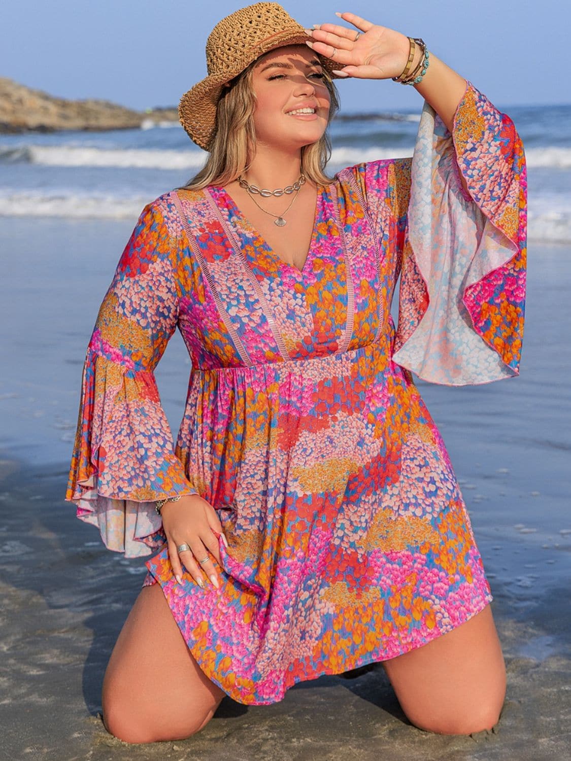 Plus Size Ruched Printed Long Sleeve Dress.