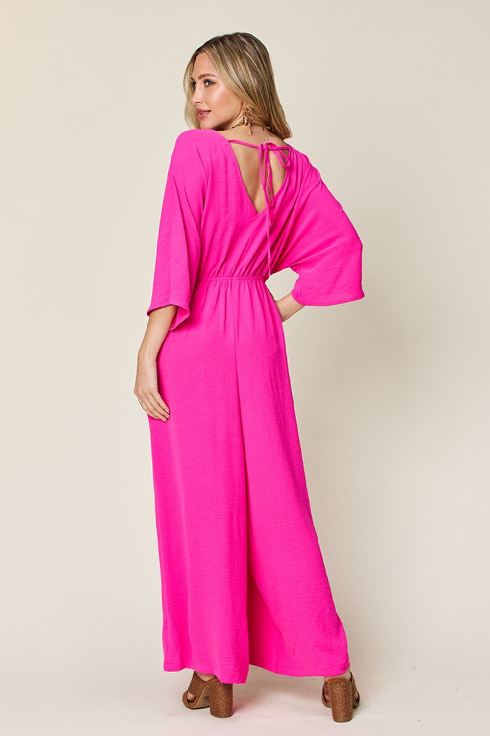 Double Take Full Size Surplice Wide Leg Jumpsuit with Pockets.