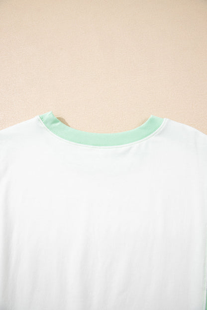 Light green color block crew neck t-shirt with exposed seams and chic design.