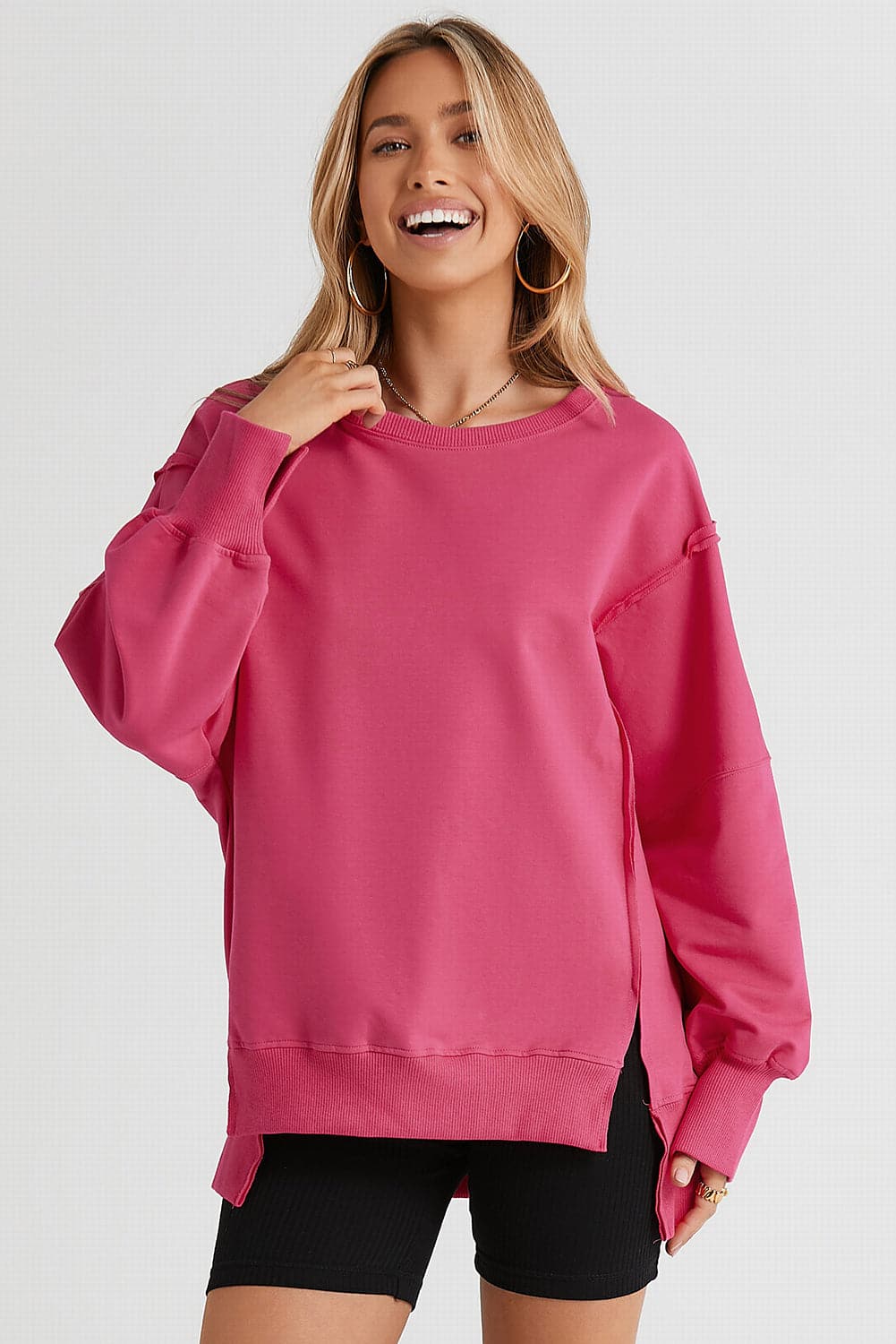 Slit Exposed Seam Round Neck Sweatshirt.