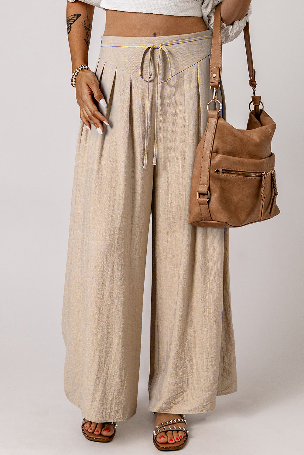 Beige high-waisted wide-leg trousers