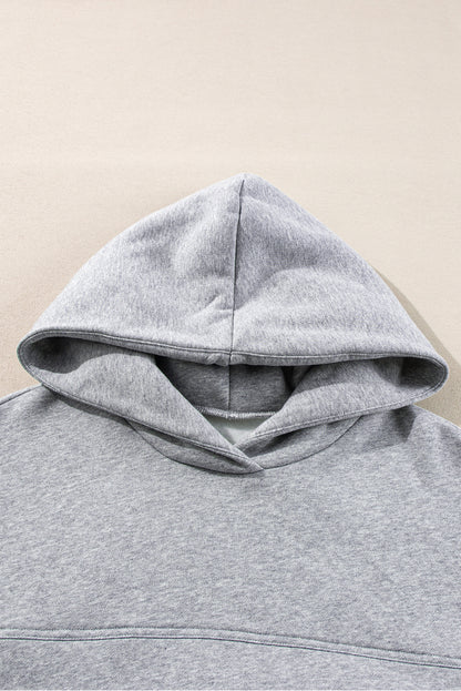 Stylish gray hoodie and joggers set with exposed seams