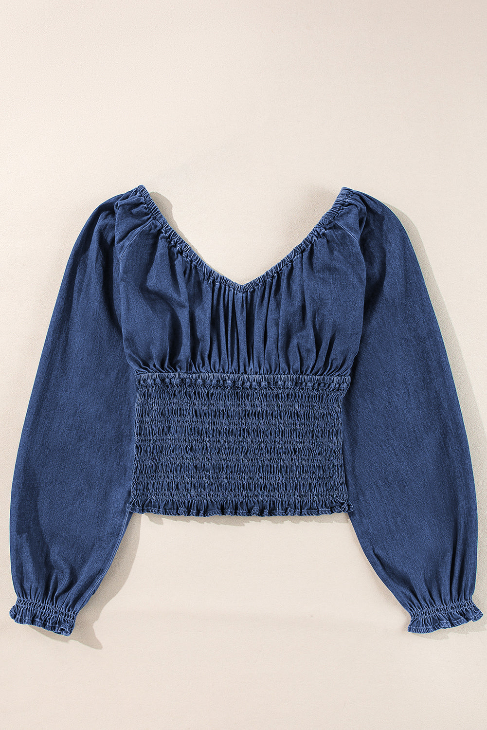 Chic dark blue ruffled puff sleeve denim blouse with smocked details