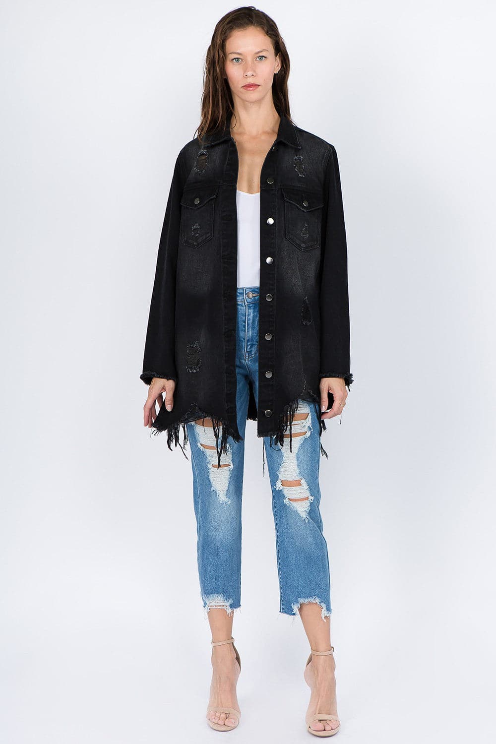 Vintage-inspired distressed denim jacket with frayed hem