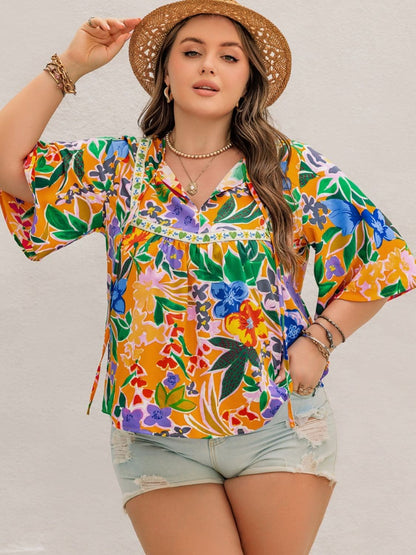 Plus Size Printed Tie Neck Half Sleeve Blouse.