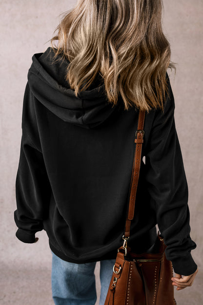 Cozy black fleece-lined hoodie with kangaroo pocket and drawstring design