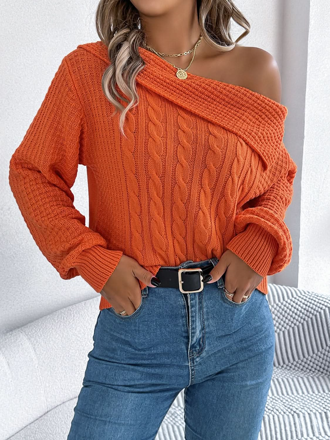 Asymmetrical cable-knit long sleeve sweater