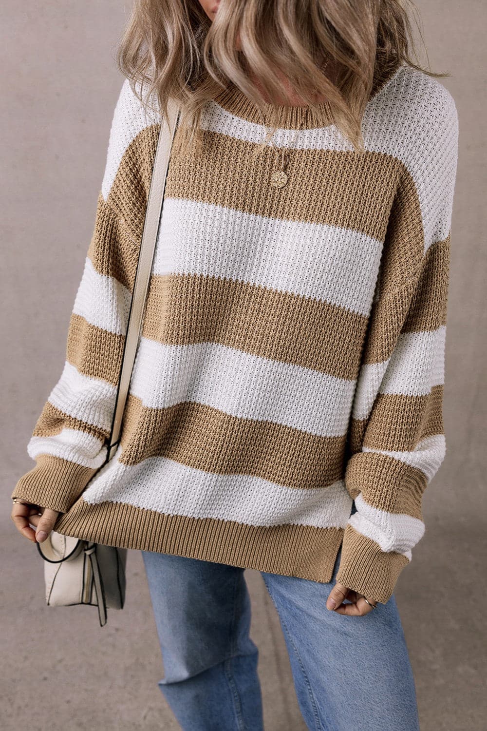 Chic color block knitted sweater with stylish stripes in beige and white, cozy fit.