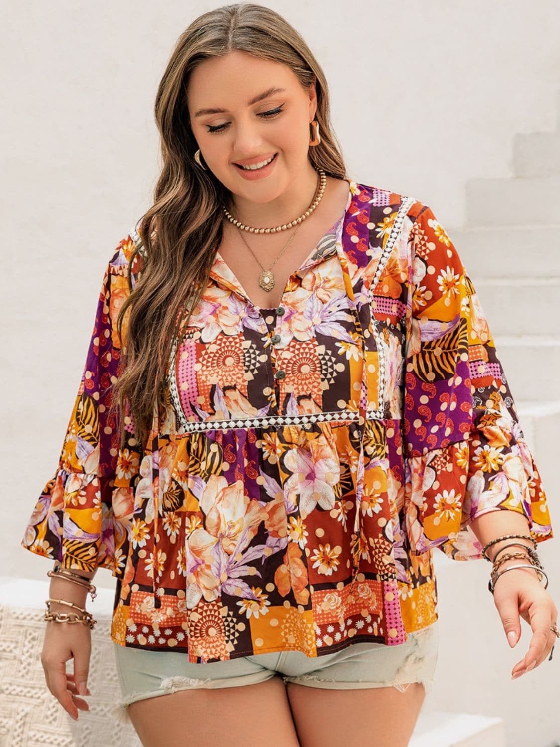 Plus Size Printed Tie Neck Blouse.