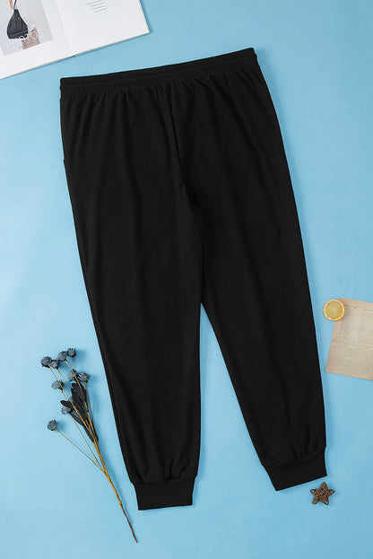 Trendy black plus size joggers with drawstring and textured design