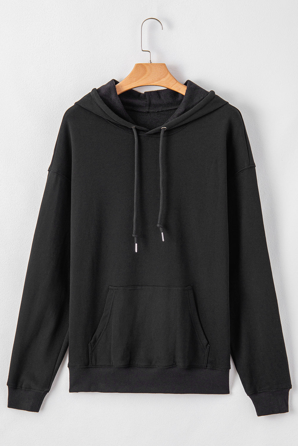 Cozy black fleece-lined hoodie with kangaroo pocket and drawstring design