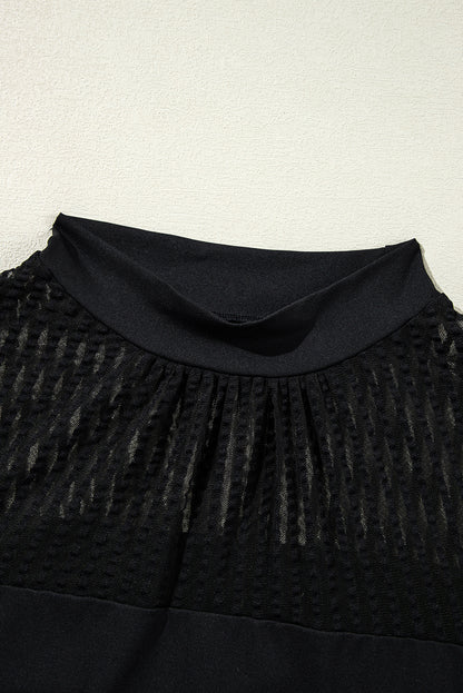 Sophisticated black mesh blouse with stand collar and lantern sleeves