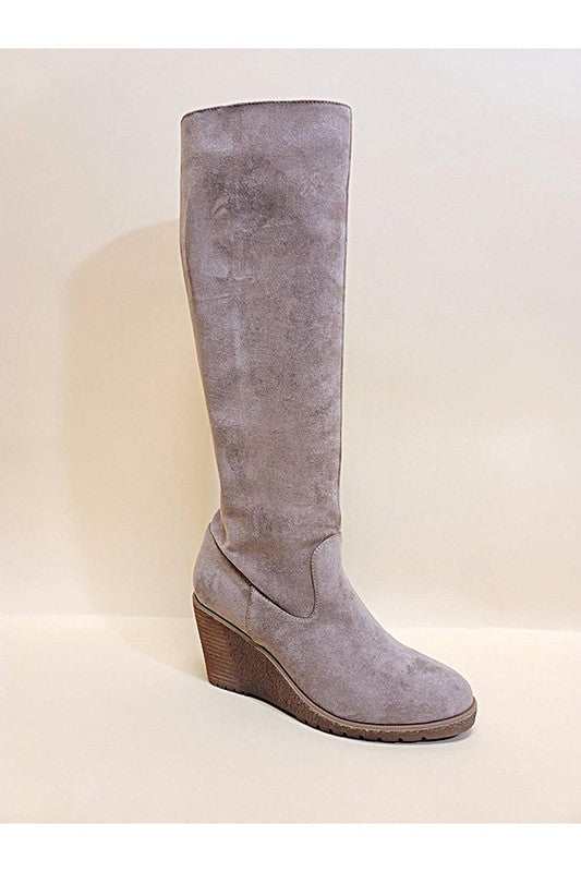 NAVAEH-WEDGES knee high boots with suede finish and rubber wedge heel.