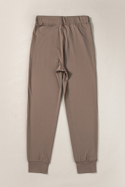 Cozy dark brown joggers with adjustable drawstring and pockets