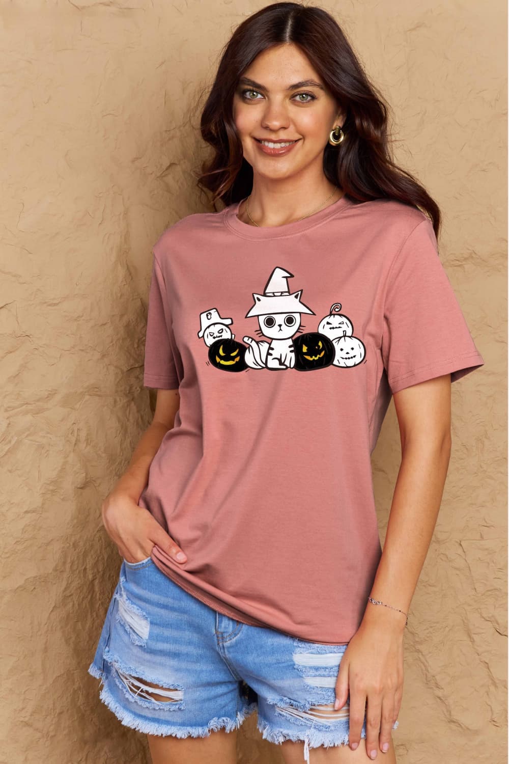 Cozy cat pumpkin tee with playful graphic design, fall style.