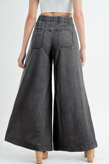 Trendy carbon grey wide leg jeans with button fly and mineral wash finish