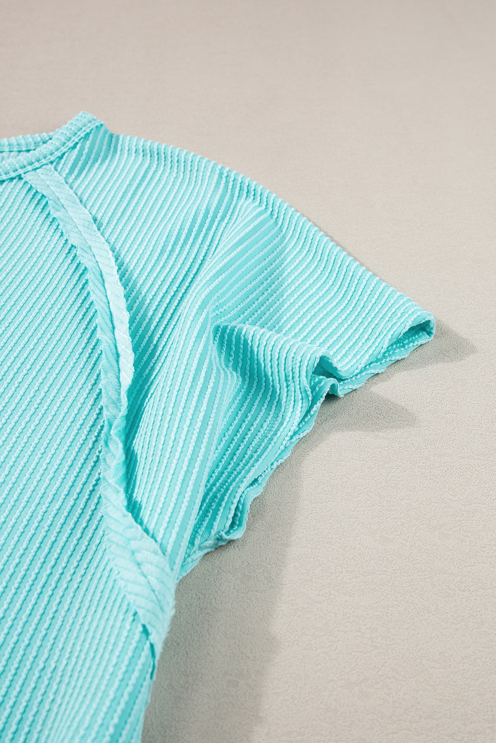 Light blue ribbed t-shirt with exposed seams for plus size comfort