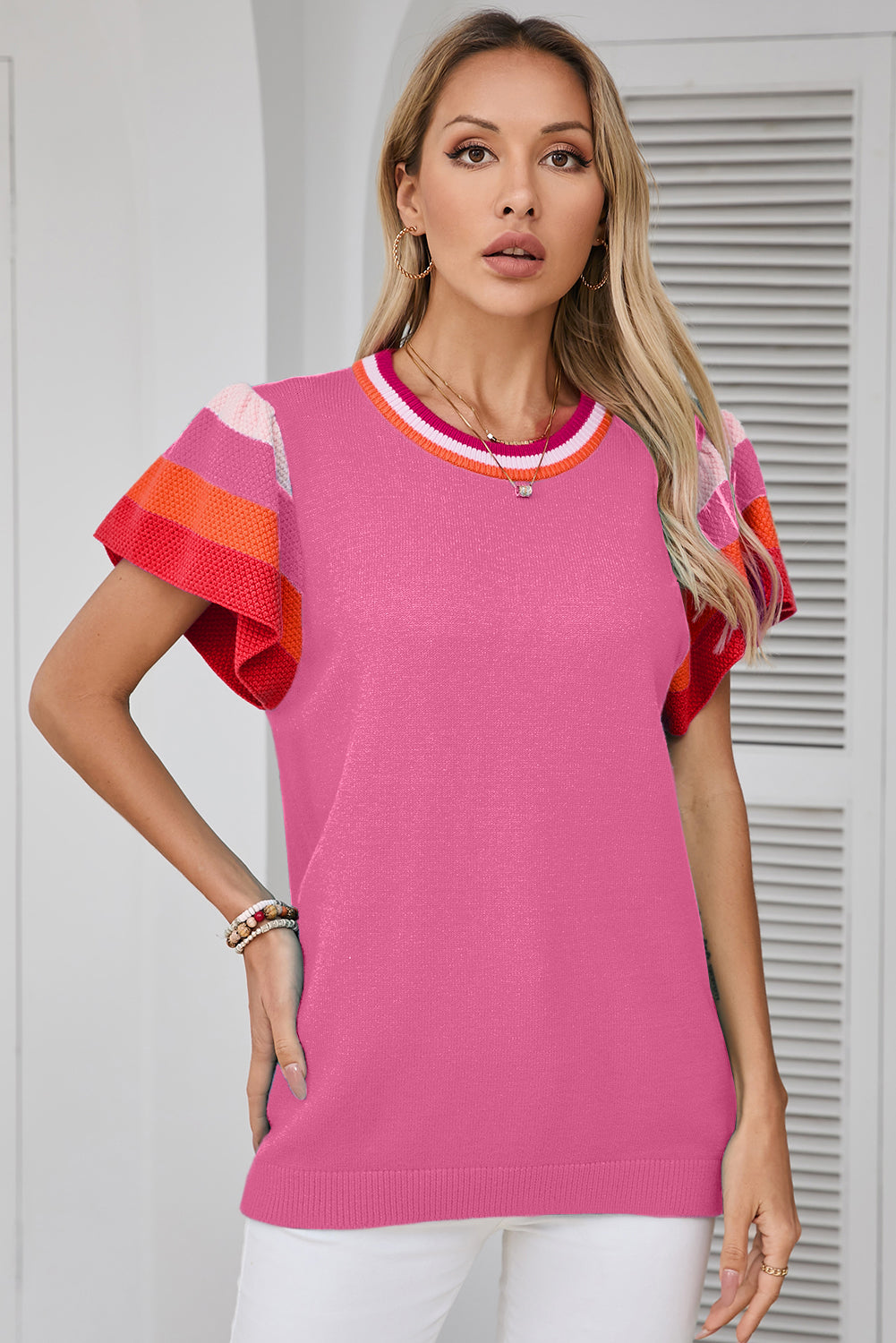 Chic bright pink knitted t-shirt with flutter sleeves