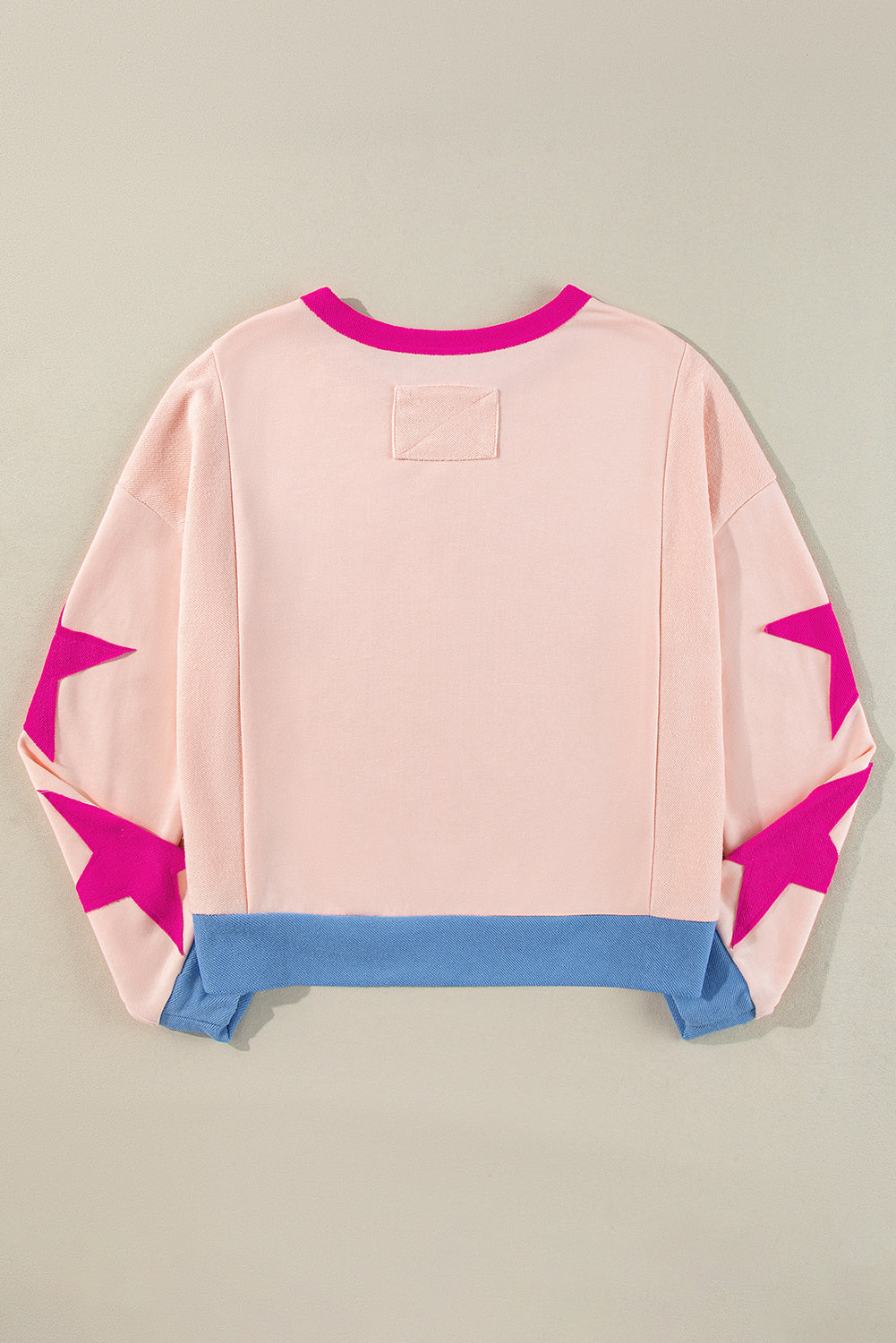 Chic light pink oversized sweatshirt with star patchwork design