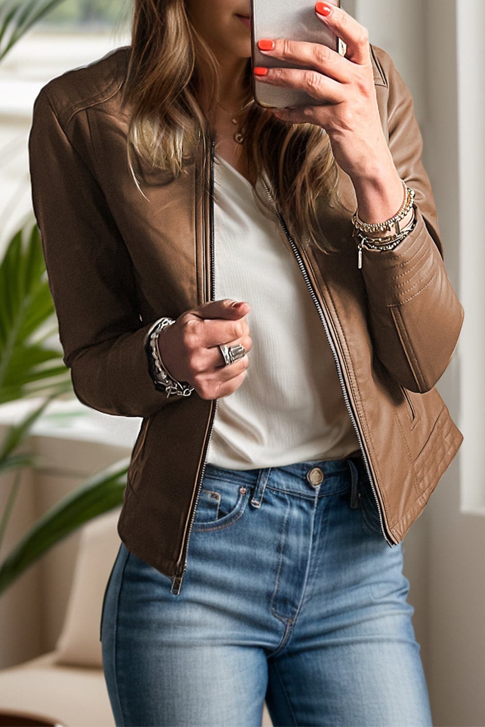 Stylish PU leather round neck jacket with long sleeves and pockets