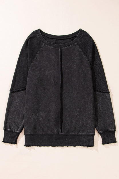 Chic black waffle knit raglan sleeve sweatshirt with patchwork detail