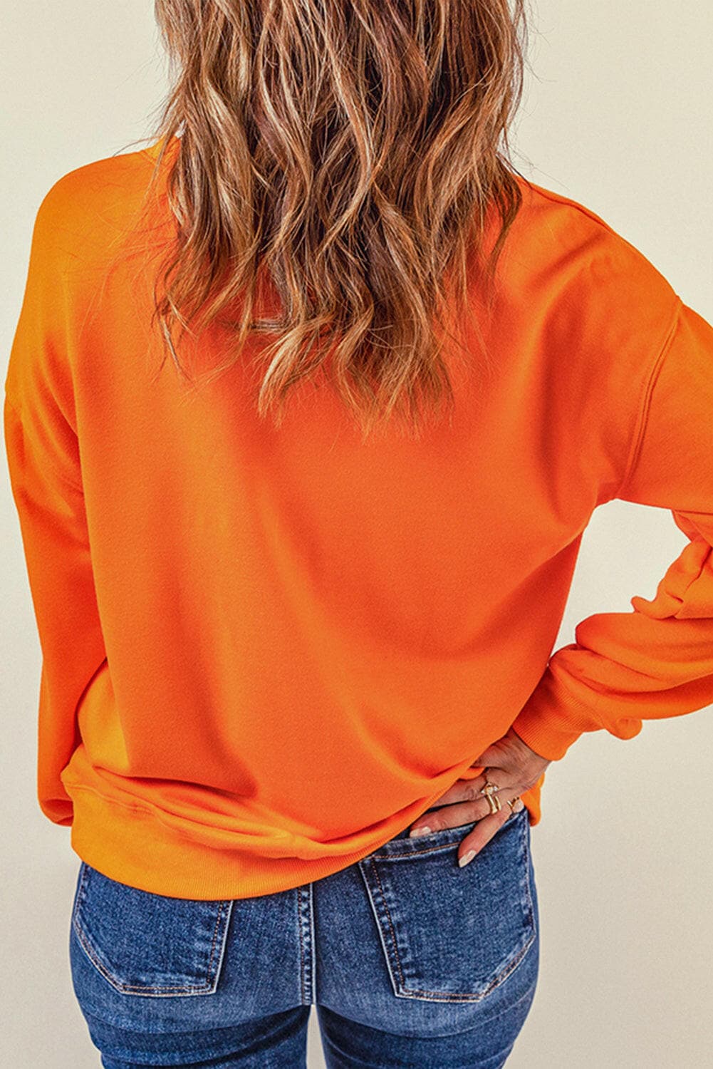 Round Neck Dropped Shoulder Sweatshirt.