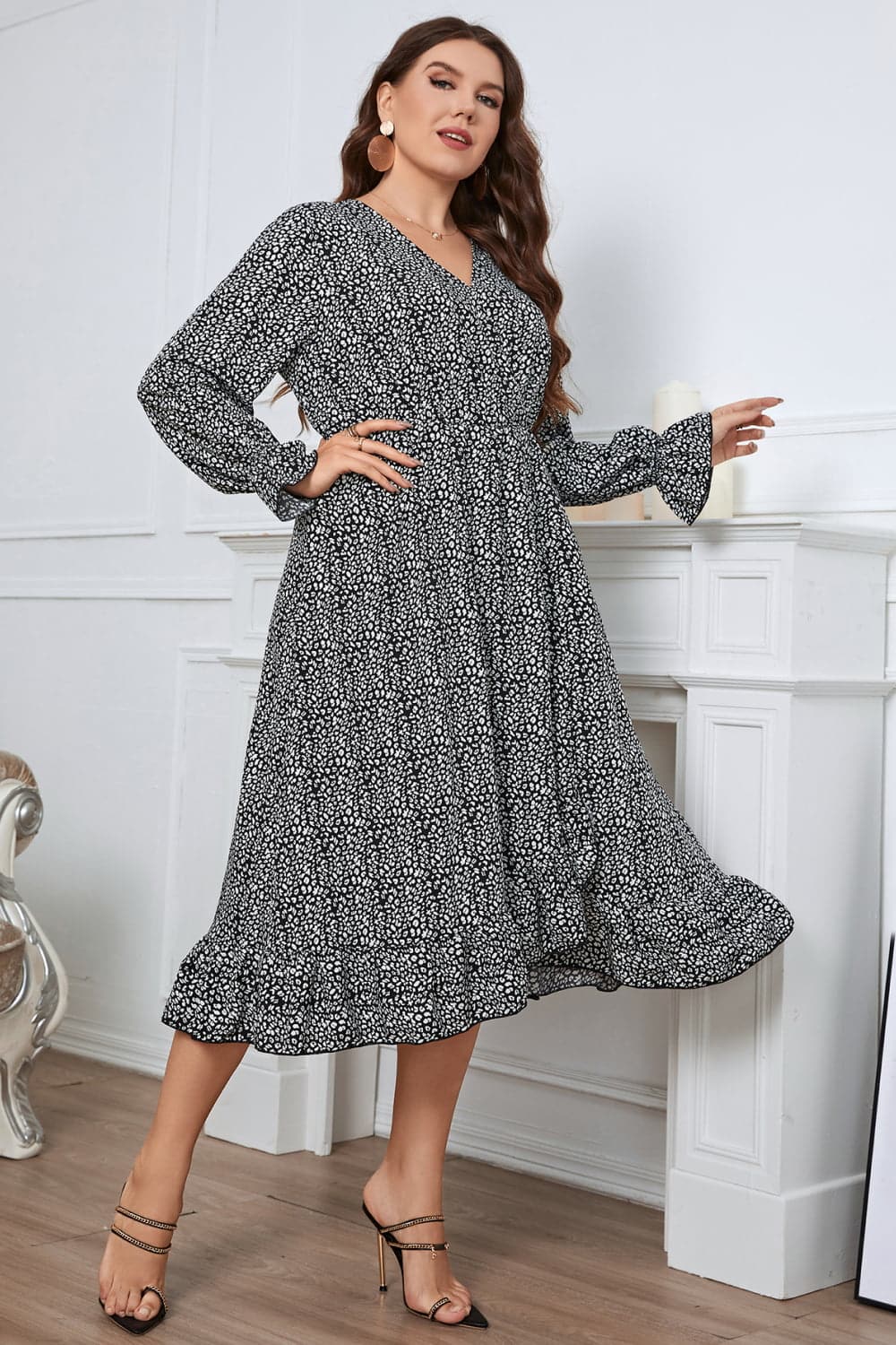 Melo Apparel Plus Size Printed V-Neck Flounce Sleeve Midi Dress.