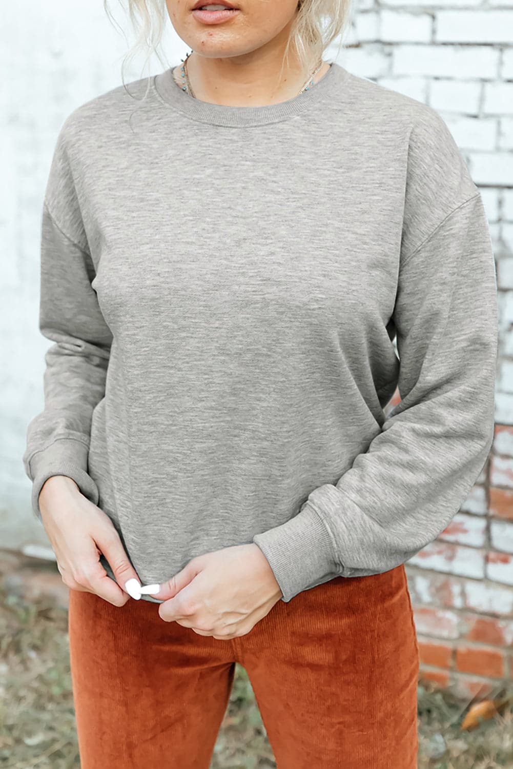 Round Neck Dropped Shoulder Sweatshirt.