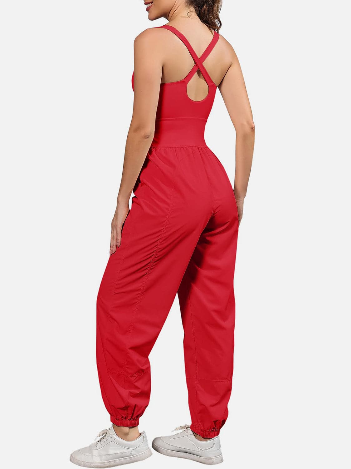 Chic cutout scoop neck jumpsuit with wide straps and pockets