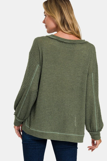 Exposed seam long sleeve top