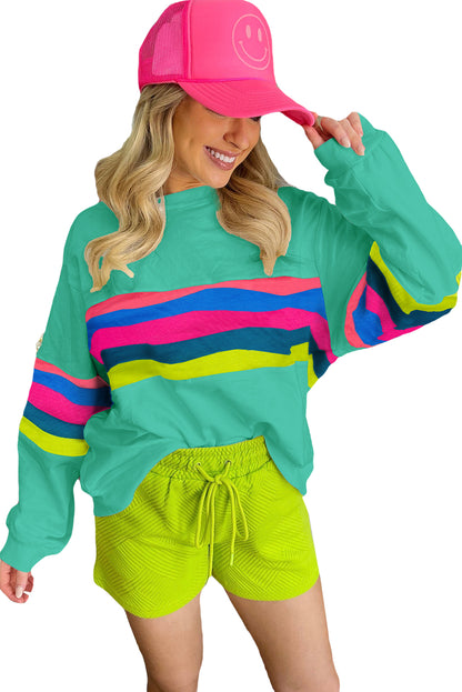 Vibrant green striped long sleeve tee for effortless style