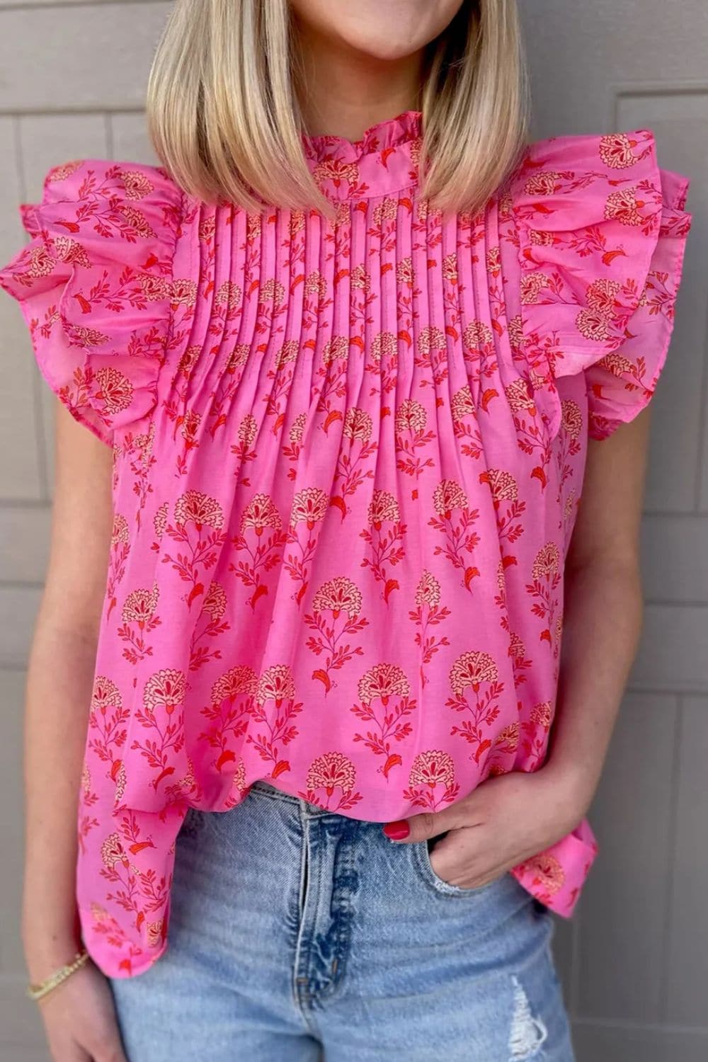 Ruffled Printed Mock Neck Cap Sleeve Blouse.