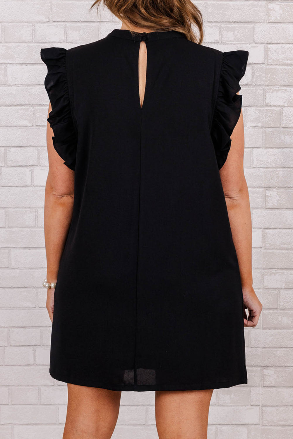 Chic black ruffled plus shift dress with keyhole back