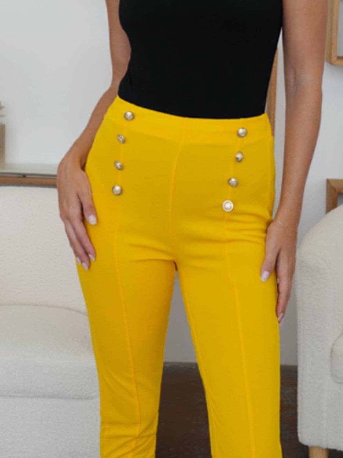 Stylish high-waisted skinny trousers with decorative buttons