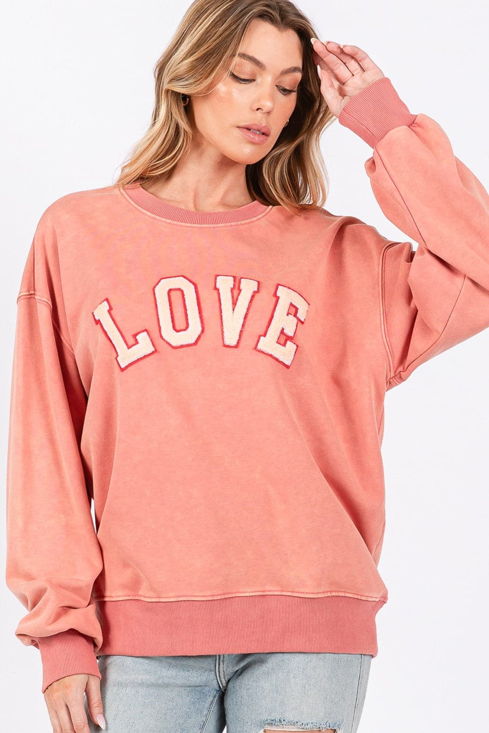 Love-inspired drop shoulder sweatshirt with playful applique details