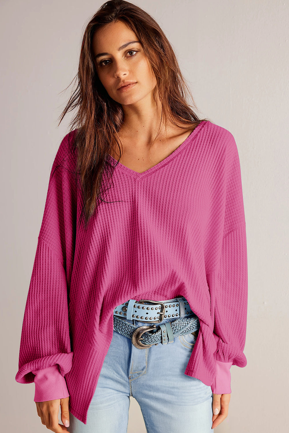 Chic bright pink waffle knit V-neck blouse with drop shoulders