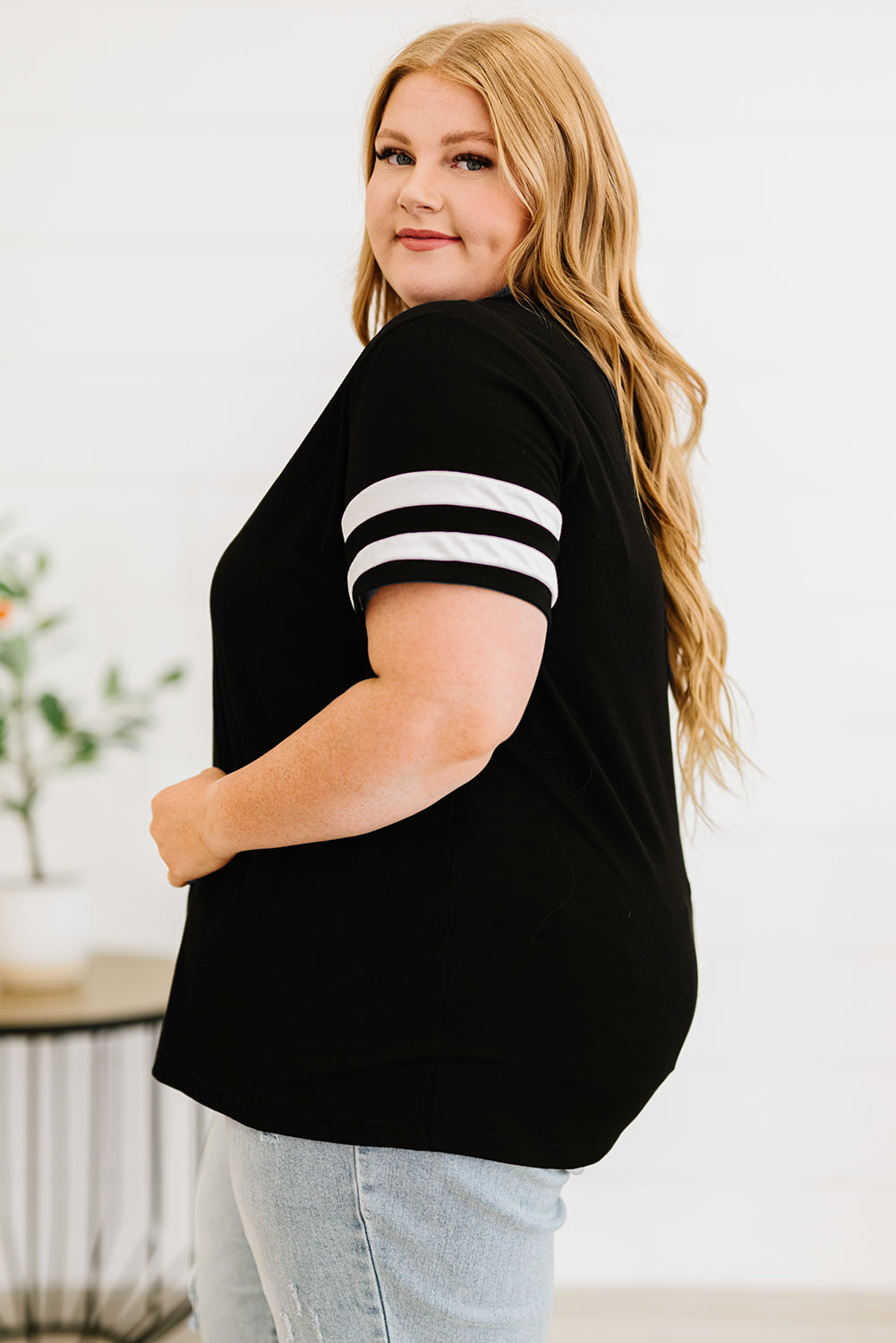 Chic black plus size V-neck tee with striped sleeves