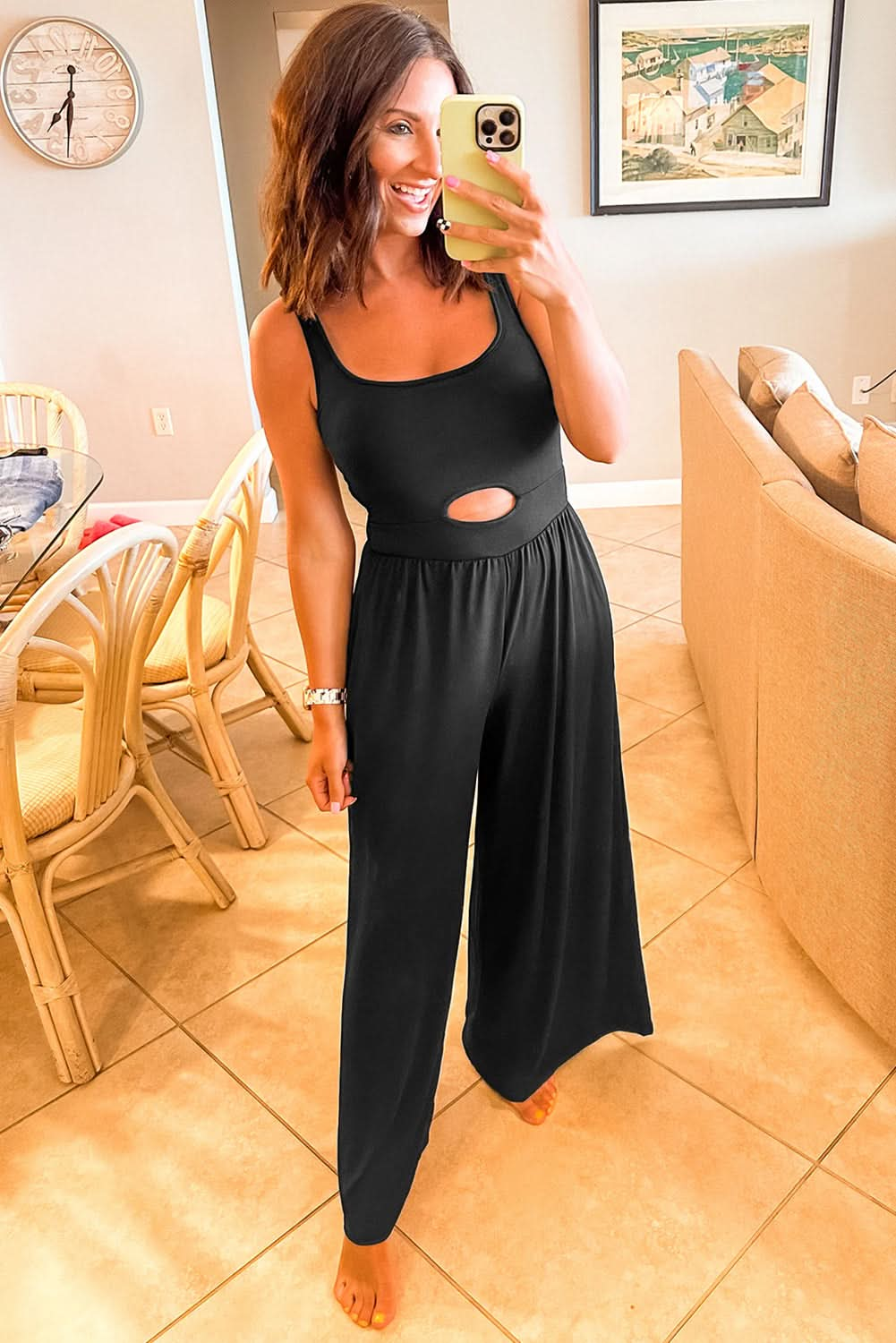 Chic Black Peekaboo Wide Leg Jumpsuit with Square Neck and Sleeveless Design