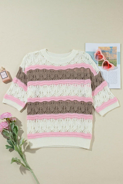 Color block knit top with round neck and openwork detailing, pink and brown stripes.