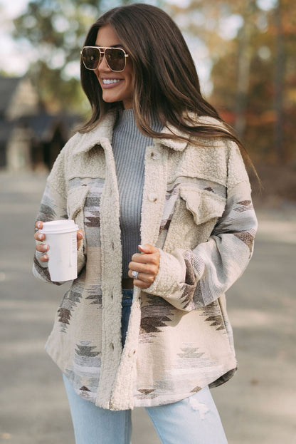 Khaki sherpa coat with vibrant Aztec print and flap pockets