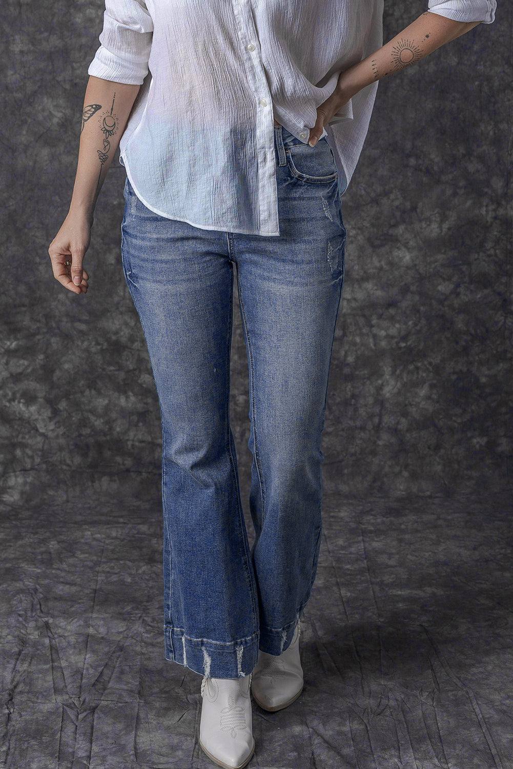 Light blue distressed flare jeans