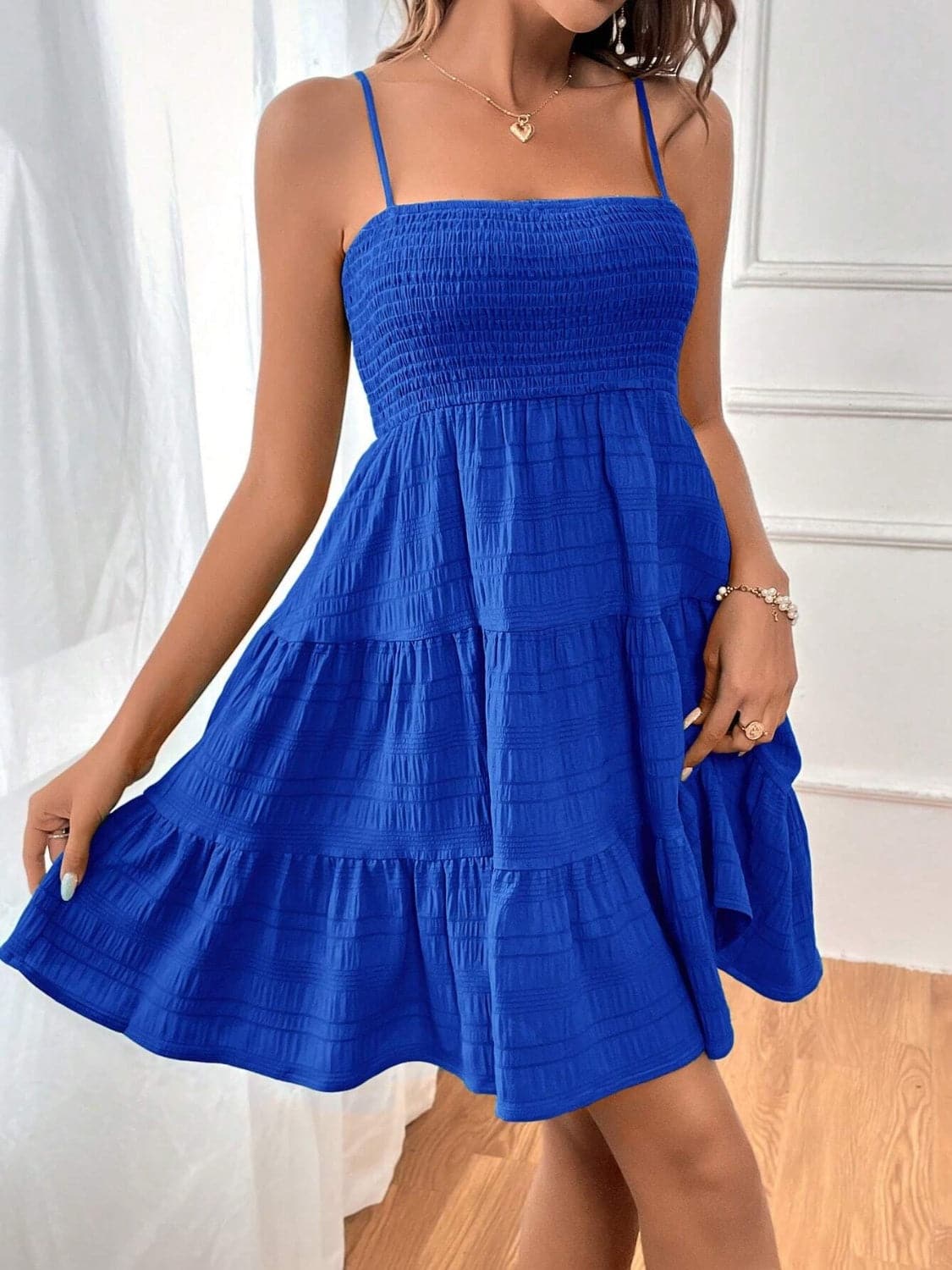 Smocked Tiered Sleeveless Mini Dress.