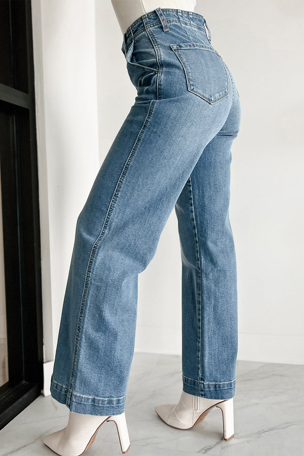 Dusk blue high-waisted loose leg jeans with unique button details