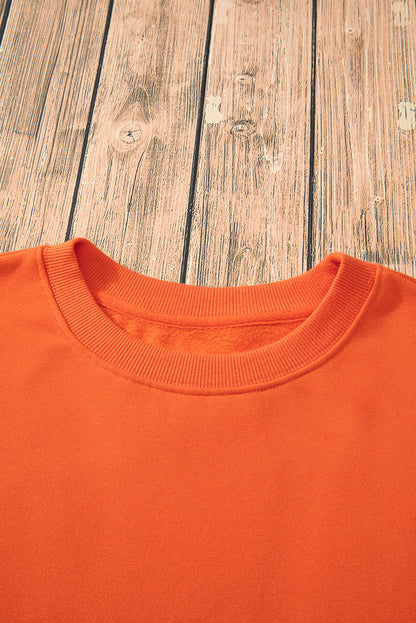 Cozy russet orange fleece-lined sweatshirt with drop shoulders